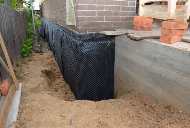 Happy homeowners after waterproofing job in Patchogue